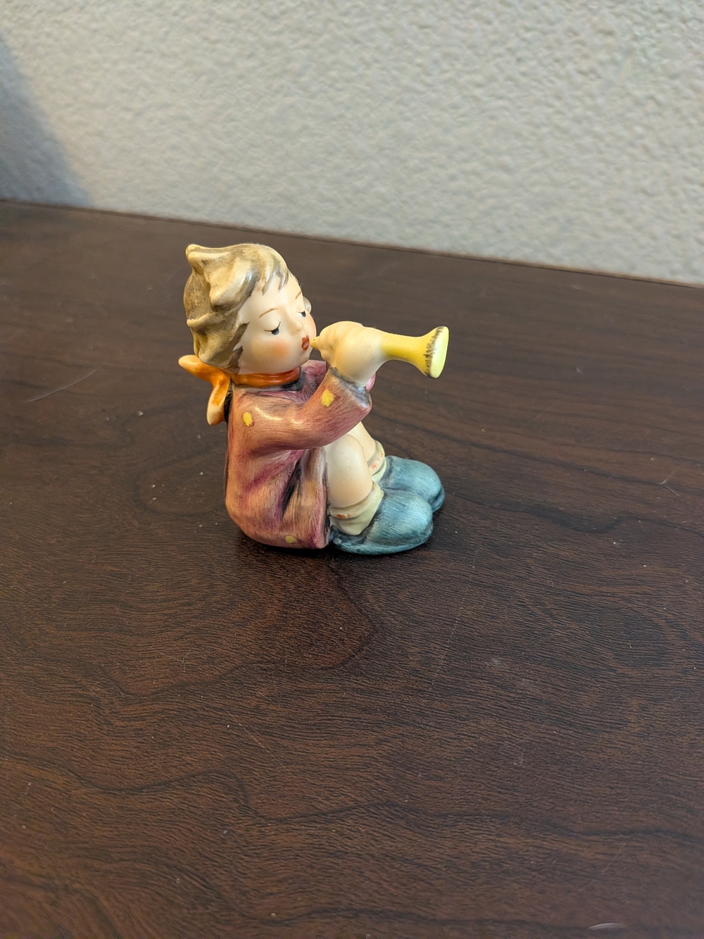 Goebel Hand-Painted Boy Playing Trunpet Figurine in Blue, Yellow, Cream